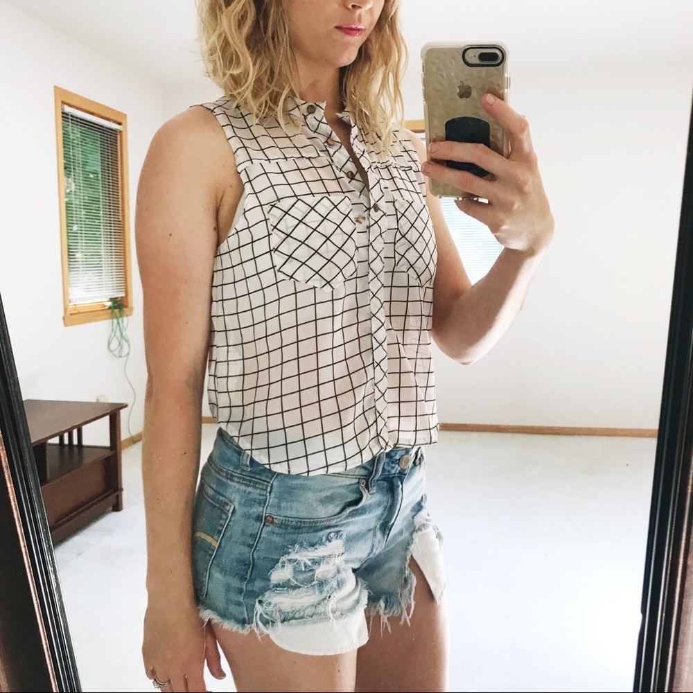 Sleeveless button up high v neck semi sheer blouse